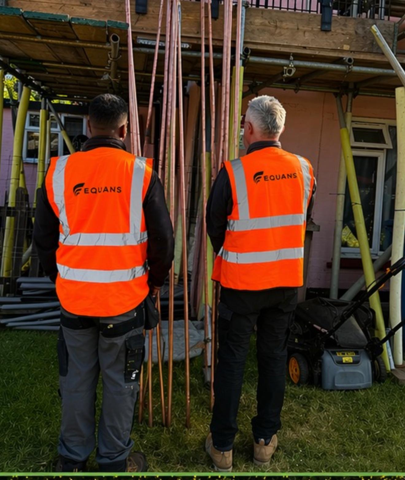GLR retrofit lead reviewing site plans with a housing officer