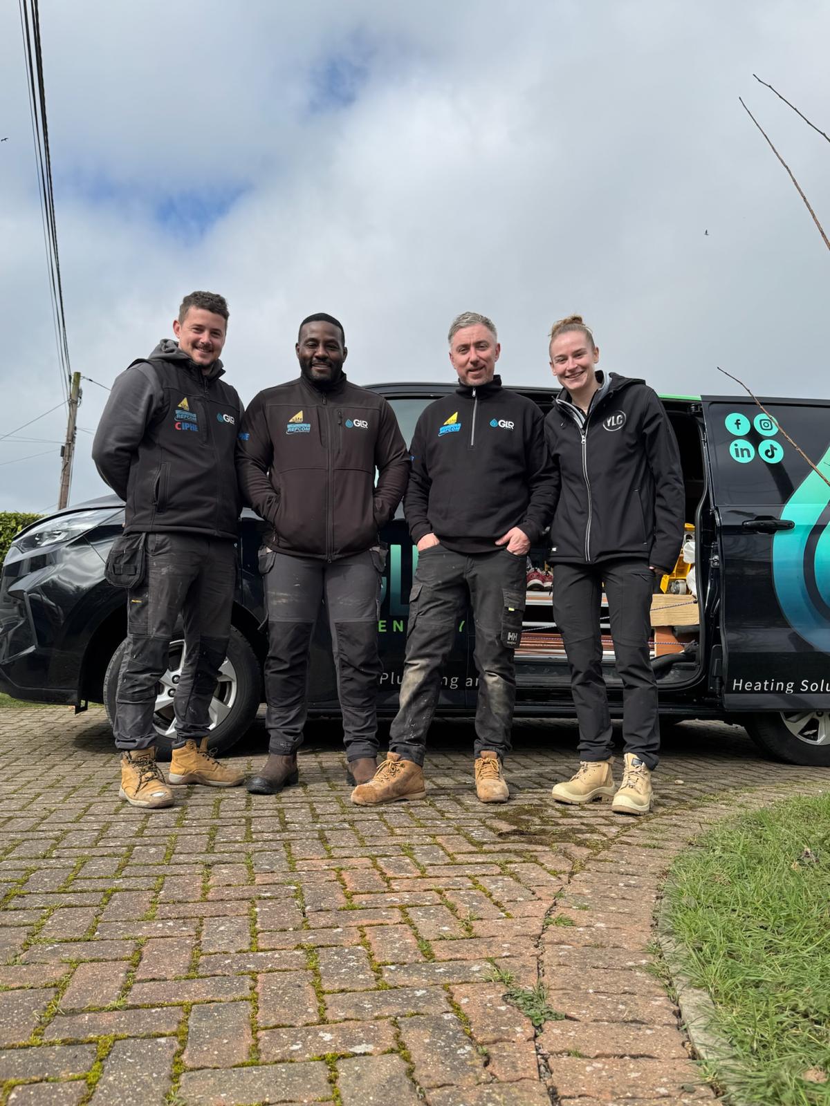 The GLR Energy team outside a retrofitted home